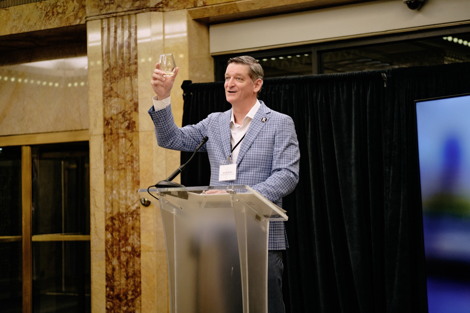 Jamie Rand raising a toast at the First National Bank Building relighting